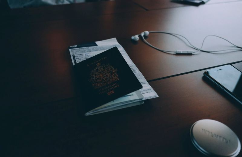 Passport and personal documents on a desk